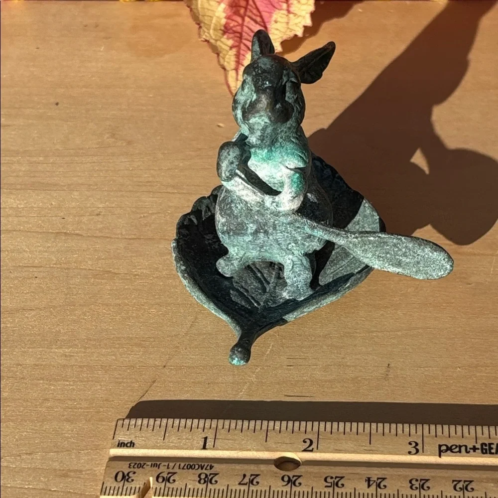 Vintage Bronze Rabbit Paddling A Leaf Boat